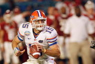 MIAMI - JANUARY 08:  Quarterback Tim Tebow #15 of the Florida Gators runs to pass the ball against the Oklahoma Sooners during the FedEx BCS National Championship Game at Dolphin Stadium on January 8, 2009 in Miami, Florida.  (Photo by Eliot J. Schechter/Getty Images