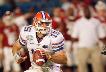 MIAMI - JANUARY 08:  Quarterback Tim Tebow #15 of the Florida Gators runs to pass the ball against the Oklahoma Sooners during the FedEx BCS National Championship Game at Dolphin Stadium on January 8, 2009 in Miami, Florida.  (Photo by Eliot J. Schechter/Getty Images