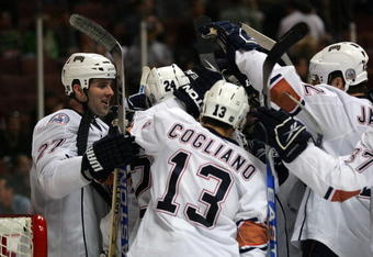 ANAHEIM, CA - MARCH 27: Dustin Penner #27 of the Edmonton Oilers and his teammates surround goaltender Dwayne Roloson #35 after they defeated the Anaheim Ducks 5-3 in the NHL game at Honda Center on March 27, 2009 in Anaheim, California. (Photo by Victor Decolongon/Getty Images)