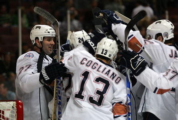 ANAHEIM, CA - MARCH 27: Dustin Penner #27 of the Edmonton Oilers and his teammates surround goaltender Dwayne Roloson #35 after they defeated the Anaheim Ducks 5-3 in the NHL game at Honda Center on March 27, 2009 in Anaheim, California. (Photo by Victor Decolongon/Getty Images)