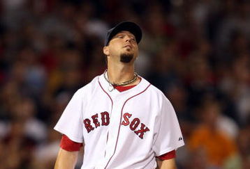 BOSTON - AUGUST 23:  Josh Beckett #19 of the Boston Red Sox reacts after a solo home run by Hideki Matsui #55 of the New York Yankees in the eighth inning on August 23, 2009 at Fenway Park in Boston, Massachusetts.  (Photo by Elsa/Getty Images)