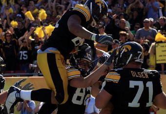 TAMPA, FL - JANUARY 01:  The Iowa Hawkeyes celebrate after a play by Ricky Stanzi against the South Carolina Gamecocks during the Outback Bowl on January 1, 2009 at Raymond James Stadium in Tampa, Florida.  (Photo by Scott Halleran/Getty Images)