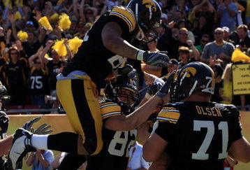 TAMPA, FL - JANUARY 01:  The Iowa Hawkeyes celebrate after a play by Ricky Stanzi against the South Carolina Gamecocks during the Outback Bowl on January 1, 2009 at Raymond James Stadium in Tampa, Florida.  (Photo by Scott Halleran/Getty Images)