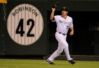 DENVER - JULY 24:  Right fielder Brad Hawpe #11 of the Colorado Rockies catches a fly ball against the San Francisco Giants at Coors Field on July 24, 2009 in Denver, Colorado. The Giants defeated the Rockies 3-1.  (Photo by Doug Pensinger/Getty Images)