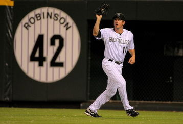DENVER - JULY 24:  Right fielder Brad Hawpe #11 of the Colorado Rockies catches a fly ball against the San Francisco Giants at Coors Field on July 24, 2009 in Denver, Colorado. The Giants defeated the Rockies 3-1.  (Photo by Doug Pensinger/Getty Images)