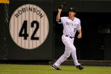 DENVER - JULY 24:  Right fielder Brad Hawpe #11 of the Colorado Rockies catches a fly ball against the San Francisco Giants at Coors Field on July 24, 2009 in Denver, Colorado. The Giants defeated the Rockies 3-1.  (Photo by Doug Pensinger/Getty Images)