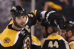 BOSTON - MAY 01:  Zdeno Chara #33 of the Boston Bruins celebrates with teammate Aaron Ward #44 after a goal in the first period against the Carolina Hurricanes during Game One of the Eastern Conference Semifinal Round of the 2009 Stanley Cup Playoffs on May 1, 2009 at the TD Banknorth Garden in Boston, Massachusetts. The Bruins defeated the Hurricanes 4-1.  (Photo by Elsa/Getty Images)