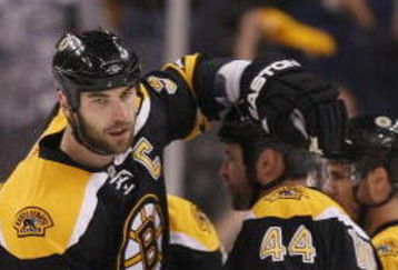 BOSTON - MAY 01:  Zdeno Chara #33 of the Boston Bruins celebrates with teammate Aaron Ward #44 after a goal in the first period against the Carolina Hurricanes during Game One of the Eastern Conference Semifinal Round of the 2009 Stanley Cup Playoffs on May 1, 2009 at the TD Banknorth Garden in Boston, Massachusetts. The Bruins defeated the Hurricanes 4-1.  (Photo by Elsa/Getty Images)