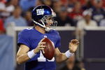 EAST RUTHERFORD, NJ - AUGUST 17:  Eli Manning #10 of the New York Giants looks to pass against the Carolina Panthers on August 17, 2009 at Giants Stadium in East Rutherford, New Jersey. The Giants defeated the Panthers 24-17.  (Photo by Jim McIsaac/Getty Images)