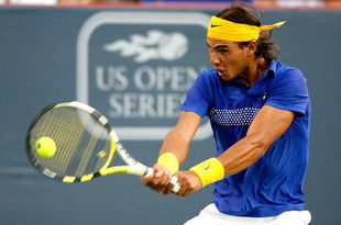 MONTREAL, QC - AUGUST 12:  Rafael Nadal of Spain returns a shot to David Ferrer of Spain during the Rogers Cup at Uniprix Stadium on August 12, 2009 in Montreal, Canada.  (Photo by Matthew Stockman/Getty Images)