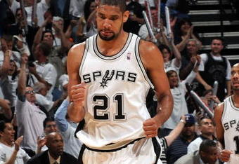 SAN ANTONIO - APRIL 20:  Forward Tim Duncan #21 of the San Antonio Spurs reacts against the Dallas Mavericks in Game Two of the Western Conference Quarterfinals during the 2009 NBA Playoffs at AT&T Center on April 20, 2009 in San Antonio, Texas. NOTE TO USER: User expressly acknowledges and agrees that, by downloading and or using this photograph, User is consenting to the terms and conditions of the Getty Images License Agreement.  (Photo by Ronald Martinez/Getty Images)