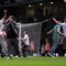 LONDON, ENGLAND - AUGUST 25: Fans invade the pitch during the Carling Cup second round match between West Ham United and Millwall at Upton Park on August 25, 2009 in London, England. . Violence broke out between West Ham and Millwall supporters, prior to kick off in tonight's second round Carling Cup at Upton Park. According to reports bricks and bottles were being used as missiles as fans broke through a riot police divide (Photo by Shaun Botterill/Getty Images)