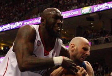PHILADELPHIA - APRIL 26:  Reggie Evans #33 of the Philadelphia 76ers battles for the ball against Marcin Gortat #13 of the Orlando Magic during Game Four of the Eastern Conference Quarterfinals during the 2009 NBA Playoffs at the Wachovia Center on April 26, 2009 in Philadelphia, Pennsylvania. NOTE TO USER: User expressly acknowledges and agrees that, by downloading and/or using this Photograph, user is consenting to the terms and conditions of the Getty Images License Agreement.  (Photo by Jim McIsaac/Getty Images)