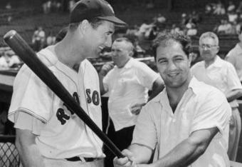 BOSTON - CIRCA 1955:  (UNDATED FILE PHOTO) Baseball legend Ted Williams (1918 - 2002) of the Boston Red Sox (L) laughs as American boxing great Rocky Marciano (1923 - 1969) swings a bat circa 1955. The 83-year-old Williams, who was the last major league player to bat .400 when he hit .406 in 1941, died July 5, 2002 at Citrus County Memorial Hospital in Florida. He died of an apparent heart attack.  (Photo by Getty Images) 