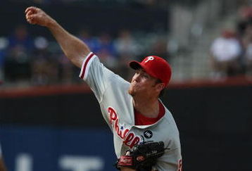 NEW YORK - AUGUST 23:  Brad Lidge #54 of the Philadelphia Phillies pitches against the New York Mets during their game on August 23, 2009 at Citi Field in the Flushing neighborhood of the Queens borough of New York City.  (Photo by Al Bello/Getty Images)