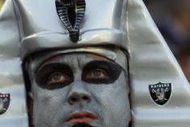 6 Jan 2001: An Oakland Raider fan watches the AFC Divisional Playoff against the Miami Dolphins at Network Associates Coliseum in Oakland, California. DIGITAL IMAGE Mandatory Credit: Tom Hauck/ALLSPORT