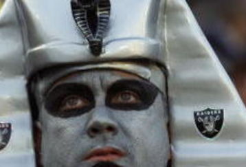6 Jan 2001: An Oakland Raider fan watches the AFC Divisional Playoff against the Miami Dolphins at Network Associates Coliseum in Oakland, California. DIGITAL IMAGE Mandatory Credit: Tom Hauck/ALLSPORT