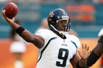 MIAMI - AUGUST 17:  Quarterback David Garrard #9 of the Jacksonville Jaguars throws a pass as he is hit by defensive end Randy Starks #94 of the Miami Dolphins during a preseason game at Landshark Stadium on August 17, 2009 in Miami, Florida.  (Photo by Doug Benc/Getty Images)