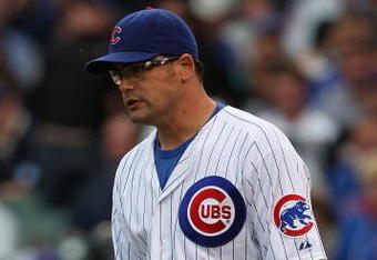 CHICAGO - JULY 08: Kevin Gregg #63 of the Chicago Cubs reacts after throwing a wild pitch in the 9th inning that allowed an Atlanta Braves runner to score on July 8, 2009 at Wrigley Field in Chicago, Illinois. The Braves defeated the Cubs 4-1. (Photo by Jonathan Daniel/Getty Images)