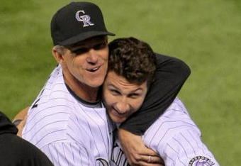 DENVER - AUGUST 25:  Troy Tulowitzki #2 of the Colorado Rockies is congratuled by manager Jim Tracy #4 for his game-winning RBI single in the 10th inning against the Los Angeles Dodgers at Coors Field on August 25, 2009 in Denver, Colorado. The Rockies defeated the Dodgers 5-4 in 10 innings.  (Photo by Doug Pensinger/Getty Images)