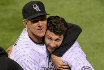 DENVER - AUGUST 25:  Troy Tulowitzki #2 of the Colorado Rockies is congratuled by manager Jim Tracy #4 for his game-winning RBI single in the 10th inning against the Los Angeles Dodgers at Coors Field on August 25, 2009 in Denver, Colorado. The Rockies defeated the Dodgers 5-4 in 10 innings.  (Photo by Doug Pensinger/Getty Images)
