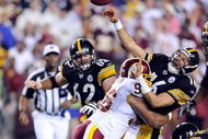 LANDOVER, MD - AUGUST 22:  Charlie Batch #16 of the Pittsburgh Steelers is hit by Cornelius Griffin #96 of the Washington Redskins at Fed Ex Field on August 22, 2009 in Landover, Maryland.  (Photo by Greg Fiume/Getty Images)