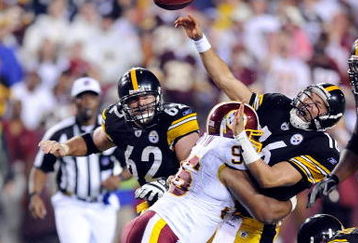 LANDOVER, MD - AUGUST 22:  Charlie Batch #16 of the Pittsburgh Steelers is hit by Cornelius Griffin #96 of the Washington Redskins at Fed Ex Field on August 22, 2009 in Landover, Maryland.  (Photo by Greg Fiume/Getty Images)