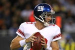 CHICAGO - AUGUST 22: Eli Manning #10 of the New York Giants looks for a receiver during a pre-season game against the Chicago Bears on August 22, 2009 at Soldier Field in Chicago, Illinois. The Bears defeated the Giants 17-3. (Photo by Jonathan Daniel/Getty Images)