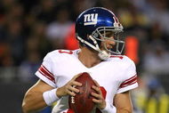 CHICAGO - AUGUST 22: Eli Manning #10 of the New York Giants looks for a receiver during a pre-season game against the Chicago Bears on August 22, 2009 at Soldier Field in Chicago, Illinois. The Bears defeated the Giants 17-3. (Photo by Jonathan Daniel/Getty Images)