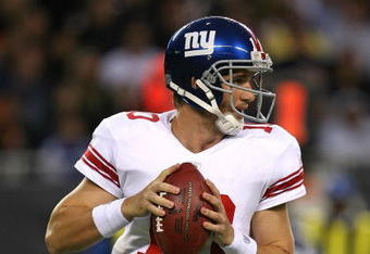 CHICAGO - AUGUST 22: Eli Manning #10 of the New York Giants looks for a receiver during a pre-season game against the Chicago Bears on August 22, 2009 at Soldier Field in Chicago, Illinois. The Bears defeated the Giants 17-3. (Photo by Jonathan Daniel/Getty Images)