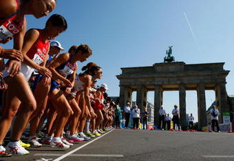 BERLIN - AUGUST 23:  Athletes start next to the Brandenburg Gate as they compete in the women's Marathon Final during day nine of the 12th IAAF World Athletics Championships on August 23, 2009 in Berlin, Germany.  (Photo by Stu Forster/Getty Images)