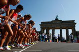 BERLIN - AUGUST 23:  Athletes start next to the Brandenburg Gate as they compete in the women's Marathon Final during day nine of the 12th IAAF World Athletics Championships on August 23, 2009 in Berlin, Germany.  (Photo by Stu Forster/Getty Images)
