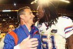 MIAMI - JANUARY 08:  Head coach Urban Meyer of the Florida Gators celebrates with Brandon Spikes #51 their win over the Oklahoma Sooners after the FedEx BCS National Championship Game at Dolphin Stadium on January 8, 2009 in Miami, Florida.  (Photo by Donald Miralle/Getty Images)