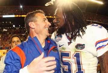 MIAMI - JANUARY 08:  Head coach Urban Meyer of the Florida Gators celebrates with Brandon Spikes #51 their win over the Oklahoma Sooners after the FedEx BCS National Championship Game at Dolphin Stadium on January 8, 2009 in Miami, Florida.  (Photo by Donald Miralle/Getty Images)