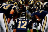 ST. LOUIS, MO - AUGUST 21:  Quarterback Kyle Boller #12 of the St. Louis Rams calls a play in the huddle against the Atlanta Falcons during the preseason game at the Edward Jones Dome on August 21, 2009 in St. Louis, Missouri. (Photo by Dilip Vishwanat/Getty Images)