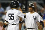 NEW YORK - AUGUST 26: Jorge Posada #20 of the New York Yankees celebrates his three run homer with team mate Hideki Matsui #55 in the second inning against the Texas Rangers during their game on August 26, 2009 at Yankee Stadium in the Bronx borough of New York City.  (Photo by Chris McGrath/Getty Images)