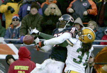 CHICAGO - DECEMBER 4:  Cornerback Al Harris #31 of the Green Bay Packers breaks up a pass in the end zone intended for Muhsin Muhammad #87 of the Chicago Bears during their game on December 4, 2005 at Soldier Field in Chicago, Illinois.  (Photo by Jonathan Daniel/Getty Images)