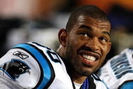 MIAMI - AUGUST 22: Defensive end Julius Peppers #90 of the Carolina Panthers watches the action from the bench while taking on the Miami Dolphins during a pre-season game at Land Shark Stadium on August 22, 2009 in Miami, Florida. The Dolphins defeated the Panthers 27-17. (Photo by Doug Benc/Getty Images)