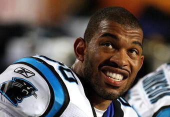 MIAMI - AUGUST 22:  Defensive end Julius Peppers #90 of the Carolina Panthers watches the action from the bench while taking on the Miami Dolphins during a pre-season game at Land Shark Stadium on August 22, 2009 in Miami, Florida. The Dolphins defeated the Panthers 27-17.  (Photo by Doug Benc/Getty Images)