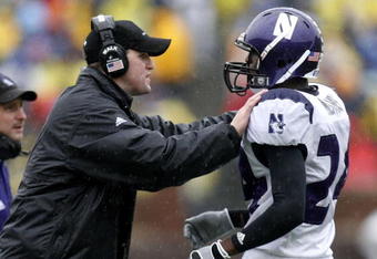 ANN ARBOR, MI - OCTOBER 28:  Head coach Pat Fitzgerald of the Northwestern Wildcats talks with Kevin Mitchell #24 during a game against the Michigan Wolverines on October 28, 2006 at Michigan Stadium in Ann Arbor, Michigan. Michigan defeated Northwestern 17-3.  (Photo by Gregory Shamus/Getty Images)