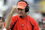 ATLANTA - NOVEMBER 20:  Head coach Al Groh shows his excitement after Alvin Pearman of the Virginia Cavaliers went 36 yards for a first down against the Georgia Tech Yellow Jackets as the Cavs defeated the Yellow Jackets 30-10 during NCAA football action at Bobby Dodd Stadium on November 20, 2004 in Atlanta, Georgia. (Photo by Doug Pensinger/Getty Images)
