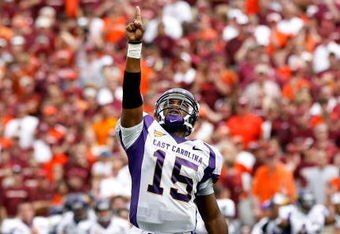 BLACKSBURG, VA - SEPTEMBER 01:  Quarterback Patrick Pinkney #15 of the East Carolina Pirates reacts after the Pirates scored a touchdown against the Virginia Tech Hokies on September 1, 2007 at Lane Stadium in Blacksburg, Virginia.  (Photo by Kevin C. Cox/Getty Images)