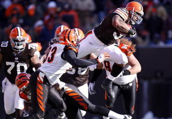 CLEVELAND - DECEMBER 21: Jamal Lewis #31 of the Cleveland Browns jumps over Chinedum Ndukwe #41 of the Cincinnati Bengals for a first quarter first down at Cleveland Browns Stadium December 21, 2008 in Cleveland, Ohio.  (Photo by Gregory Shamus/Getty Images)