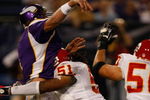 MINNEAPOLIS, MN - AUGUST 21: Quarterback Brett Favre #4 of the Minnesota Vikings gets tackled just after passing the football by linebacker Corey Mays #51 the Kansas City Chiefs at Hubert H. Humphrey Metrodome on August 21, 2009 in Minneapolis, Minnesota. (Photo by Scott Boehm/Getty Images)