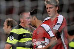LONDON, ENGLAND - AUGUST 26:  Eduardo of Arsenal is confronted by Scott Brown of Celtic after winning a first half penalty for his team during the UEFA Champions League 2nd qualifying round 2nd leg match between Arsenal and Celtic at the Emirates Stadium on August 26, 2009 in London, England.  (Photo by Shaun Botterill/Getty Images)
