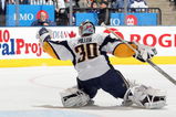 TORONTO - APRIL 8:  Goalie Ryan Miller #30 of the Buffalo Sabres blocks the puck against the Toronto Maple Leafs during their NHL game at the Air Canada Centre on April 8, 2009 in Toronto, Ontario. (Photo by: Dave Sandford/Getty Images)