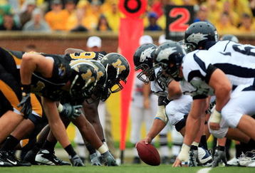 COLUMBIA, MO - SEPTEMBER 13:  The Nevada Wolf Pack offense faces off against the Missouri Tigers defense during the first half of the game on September 13, 2008 at Memorial Stadium in Columbia, Missouri.  (Photo by Jamie Squire/Getty Images)