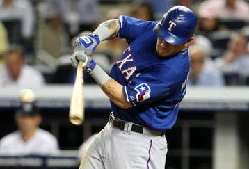 NEW YORK - AUGUST 25:  Josh Hamilton #32 of the Texas Rangers hits a 2-run signal in the top of the fourth inning against the New York Yankees on August 25, 2009 at Yankee Stadium in the Bronx borough of New York City. (Photo By Al Bello/Getty Images)