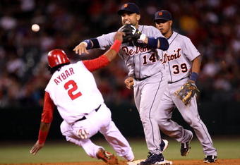 ANAHEIM, CA - AUGUST 24:  Second baseman Placido Polanco #14 of the Detroit Tigers throws to first to complete a double play after forcing out Erick Aybar #2 of the Los Angeles Angels of Anaheim to end the fifth inning on August 24, 2009 at Angel Stadium in Anaheim, California.   (Photo by Stephen Dunn/Getty Images)