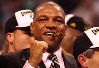 BOSTON - JUNE 17:  Head coach Doc Rivers of the Boston Celtics celebrates with a victory cigar after defeating the Los Angeles Lakers in Game Six of the 2008 NBA Finals on June 17, 2008 at TD Banknorth Garden in Boston, Massachusetts. NOTE TO USER: User expressly acknowledges and agrees that, by downloading and/or using this Photograph, user is consenting to the terms and conditions of the Getty Images License Agreement.  (Photo by Elsa/Getty Images)